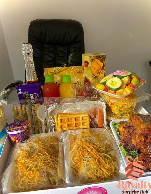Celebration catering tray with jollof rice and grilled chicken
